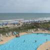 Enjoy a cool drink on the balcony and watch the surf and pool below.